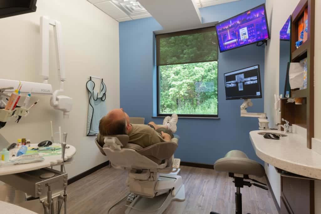 Patient laying in Dentist room - Laurich Dentistry - Canton - Farmington Hills - Livonia