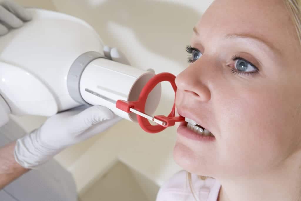 Woman having dental x-rays taken